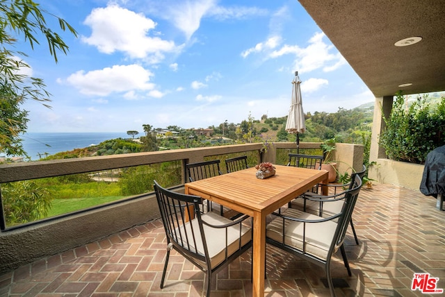 view of patio / terrace featuring a water view