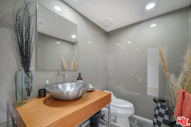 bathroom with vanity and toilet