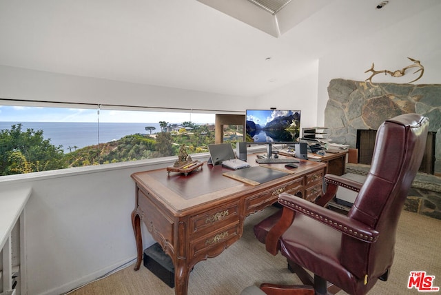 carpeted home office featuring a water view and vaulted ceiling