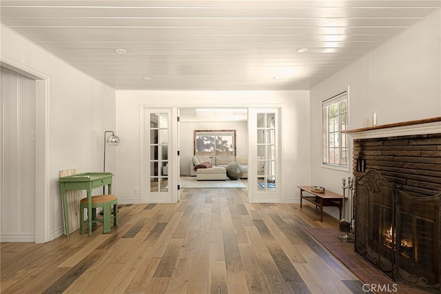 interior space with a fireplace and hardwood / wood-style flooring