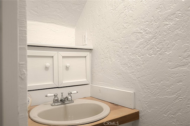 bathroom featuring vanity and a textured ceiling