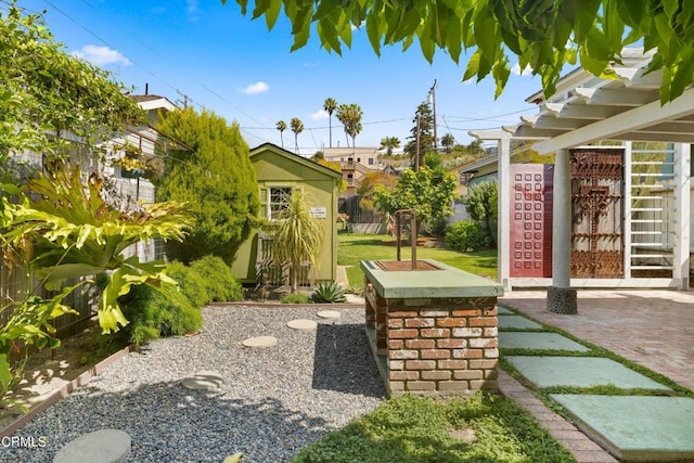 view of yard featuring a patio area and a storage unit