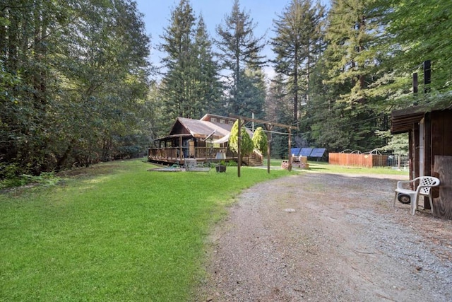 view of yard with a wooden deck