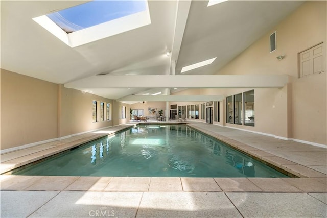 view of pool featuring a skylight