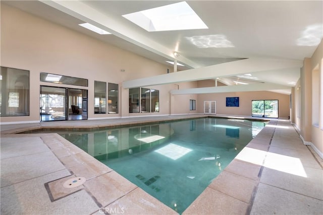 view of swimming pool featuring a skylight