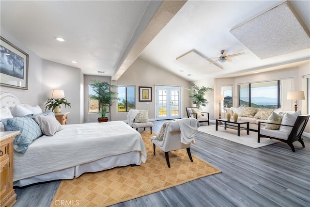 bedroom featuring french doors, hardwood / wood-style flooring, ceiling fan, and lofted ceiling