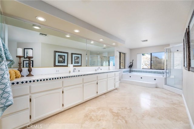 bathroom with separate shower and tub and vanity