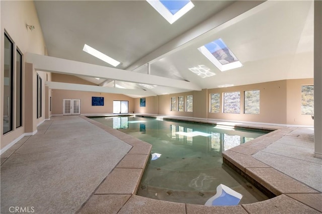 view of swimming pool with a skylight