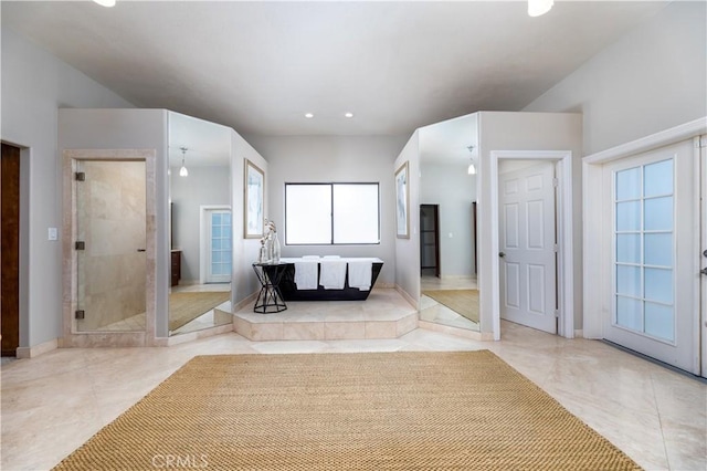 bathroom featuring plus walk in shower and tile patterned floors