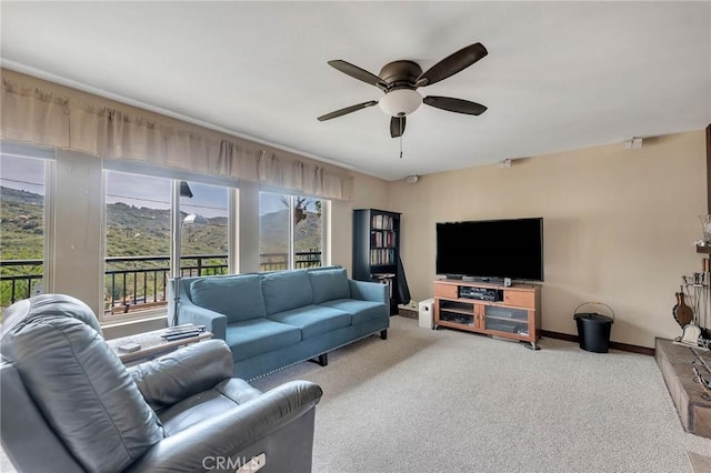 living room with carpet flooring and ceiling fan