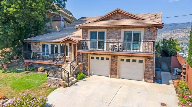 tri-level home with a mountain view and a garage