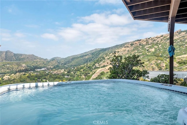 view of pool with a mountain view