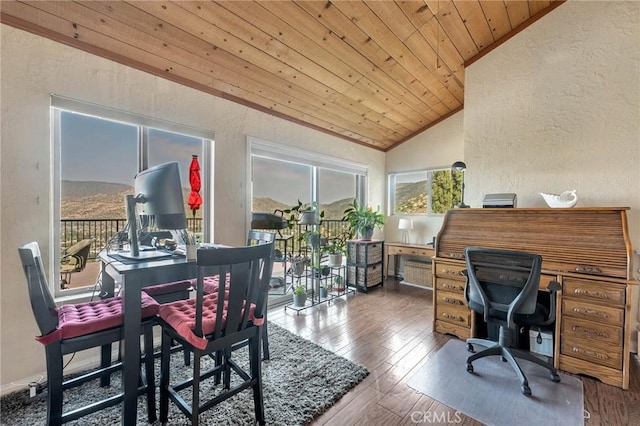 dining area featuring hardwood / wood-style floors, wooden ceiling, and lofted ceiling