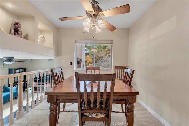 tiled dining room featuring ceiling fan