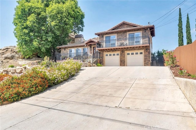 view of front of house with a balcony and a garage