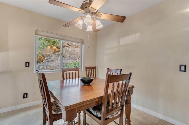 dining room with ceiling fan and light tile patterned floors