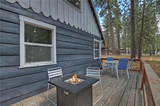 wooden deck featuring a fire pit