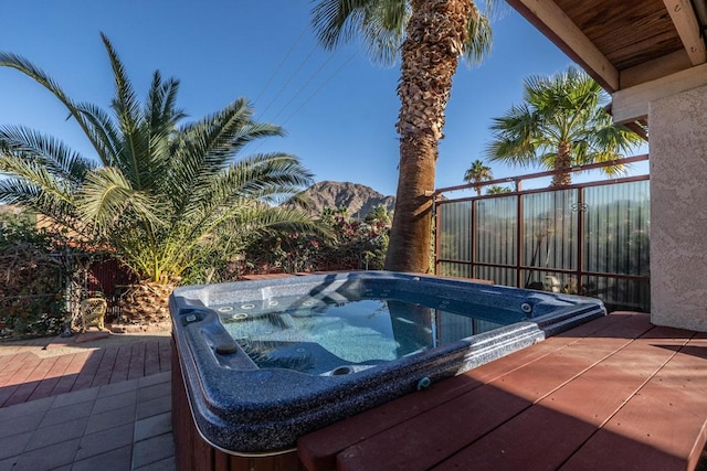 view of swimming pool featuring an outdoor hot tub