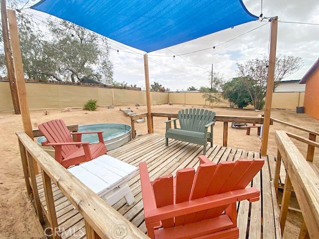 61974 Terrace Dr, Joshua Tree, CA 92252 - fenced backyard with a swimming pool and a deck
