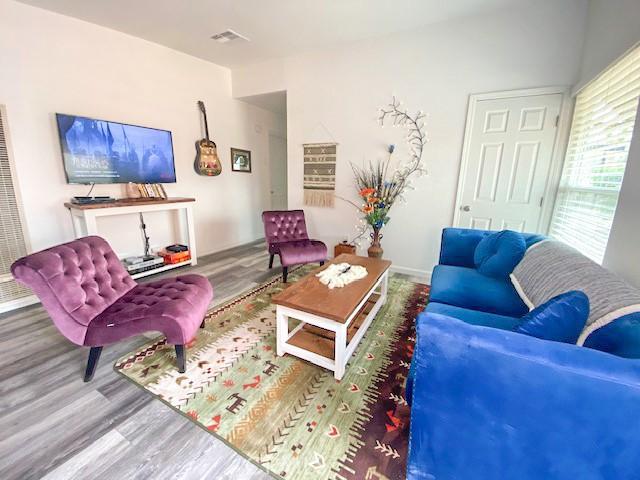 61974 Terrace Dr, Joshua Tree, CA 92252 - living room with wood finished floors and a heating unit
