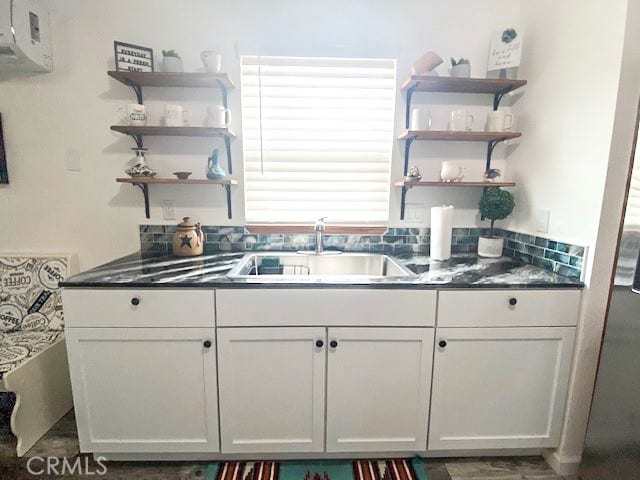 kitchen with sink and white cabinets