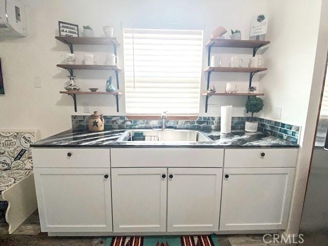 61974 Terrace Dr, Joshua Tree, CA 92252 - kitchen featuring open shelves, dark countertops, white cabinets, and wood finished floors