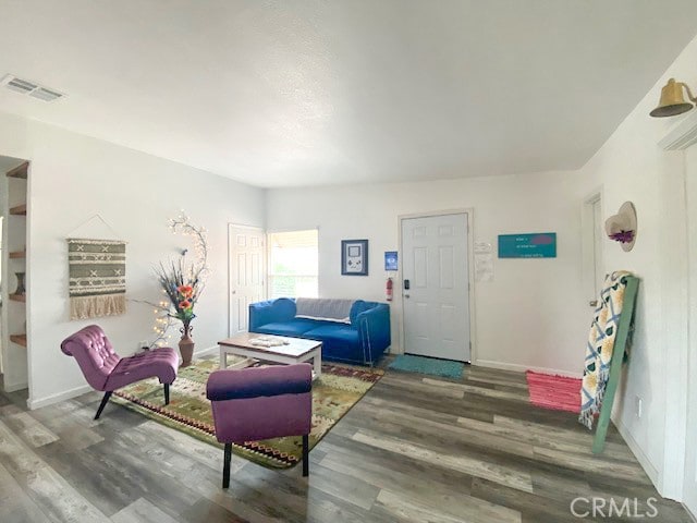 living room with dark hardwood / wood-style flooring