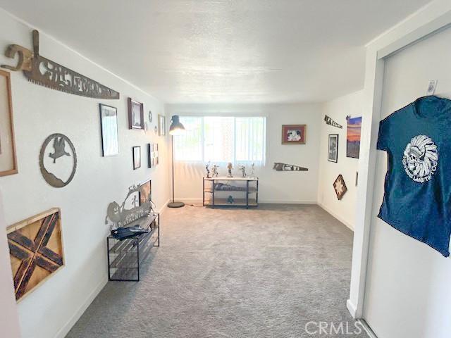 61974 Terrace Dr, Joshua Tree, CA 92252 - corridor with carpet and baseboards