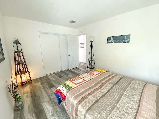 bedroom featuring a closet and hardwood / wood-style flooring