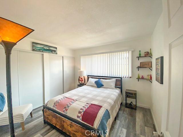 61974 Terrace Dr, Joshua Tree, CA 92252 - bedroom with wood finished floors and a closet