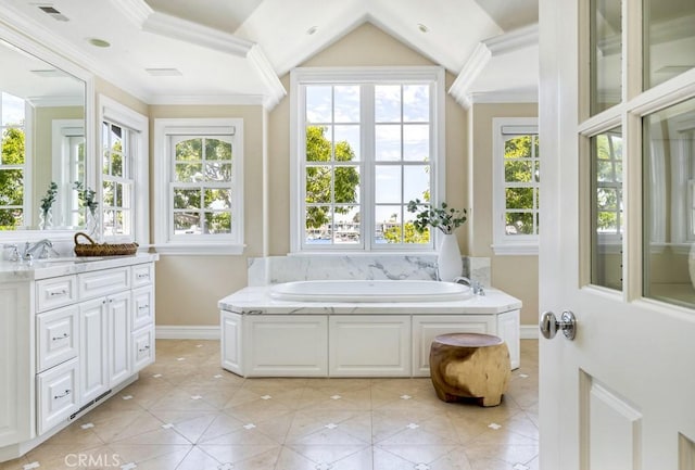 bathroom featuring vanity, a tub, and crown molding