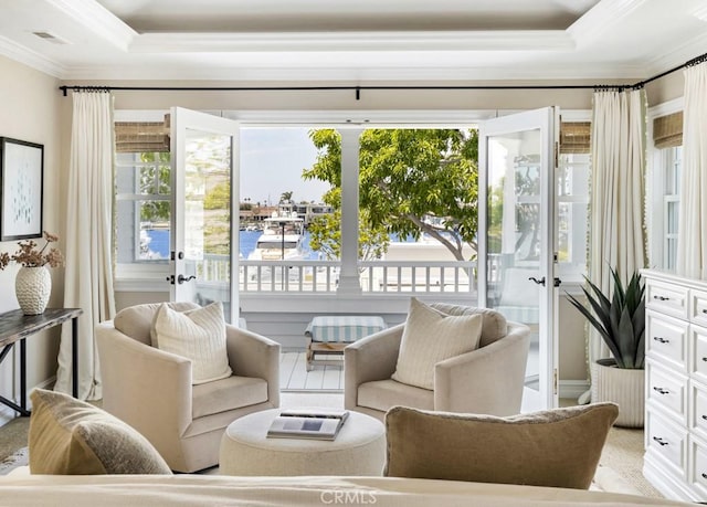 sunroom / solarium with a tray ceiling