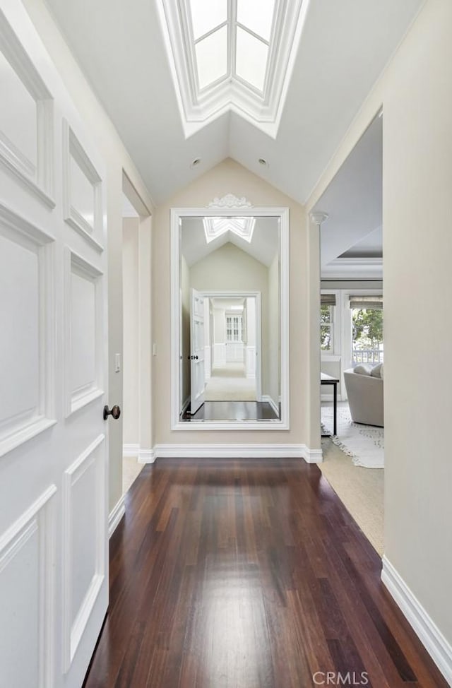 hallway featuring vaulted ceiling and dark wood-type flooring