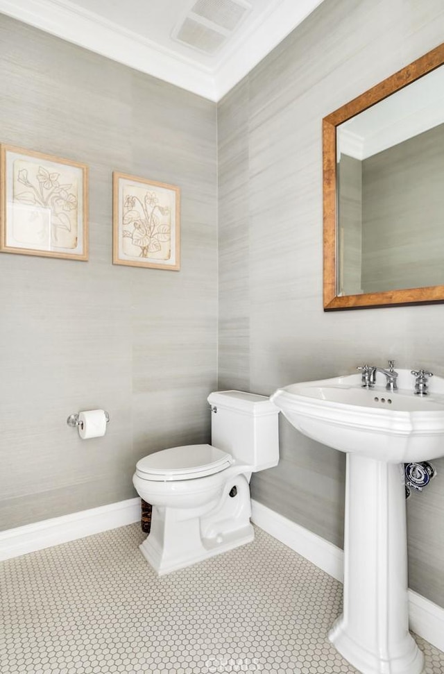 bathroom featuring tile patterned floors, toilet, and sink