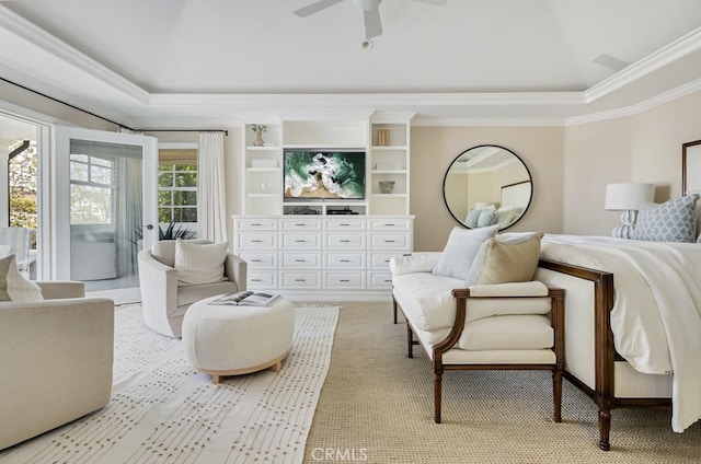 bedroom featuring ceiling fan, a raised ceiling, and crown molding