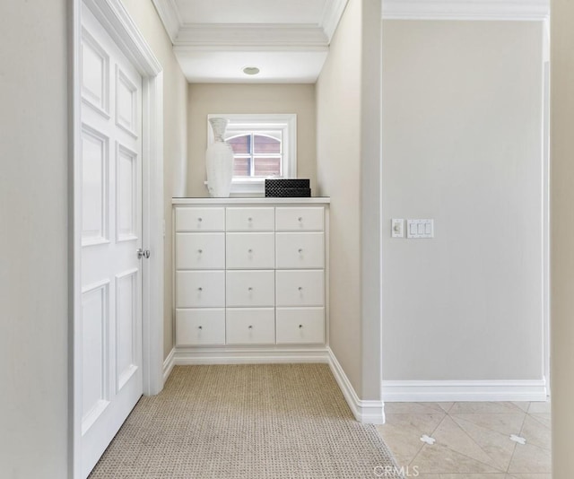 interior space featuring light tile patterned floors and crown molding