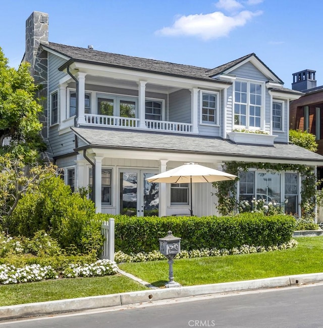 view of front of home with a balcony