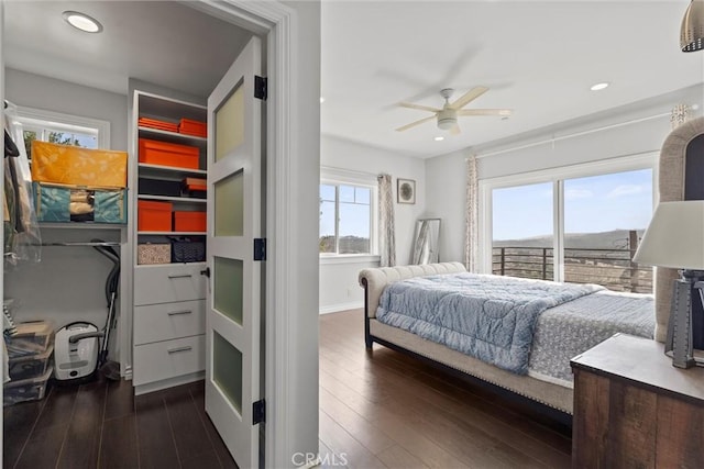 bedroom with dark hardwood / wood-style floors