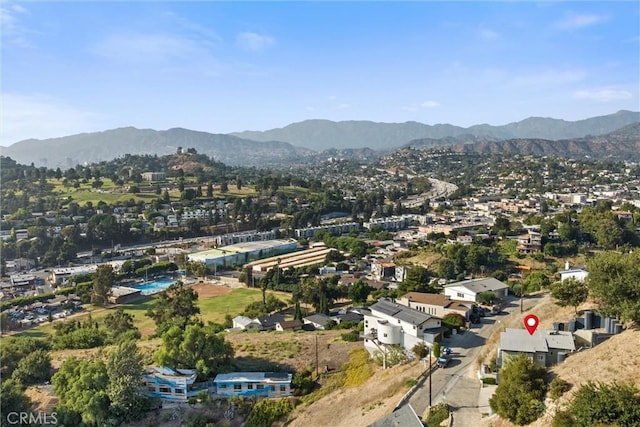 birds eye view of property with a mountain view