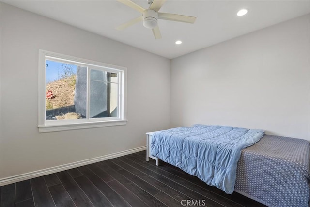 bedroom featuring ceiling fan and dark hardwood / wood-style flooring