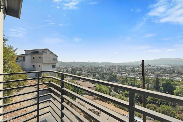 balcony featuring a mountain view