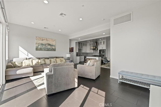 living room with dark tile patterned floors