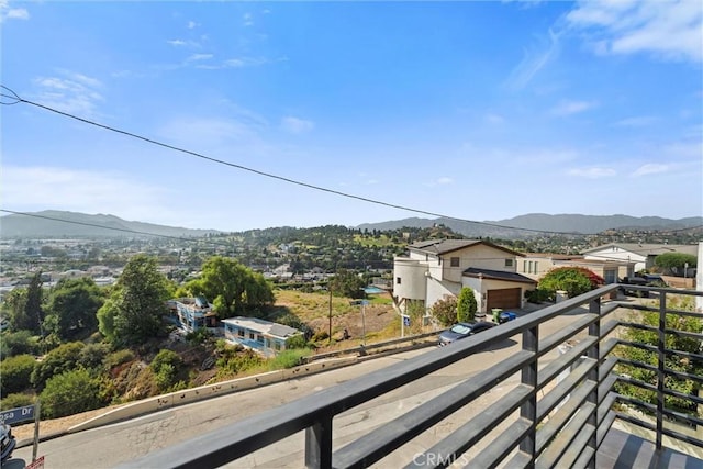 balcony featuring a mountain view