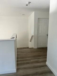 53209 Trailing Rose Dr, Lake Elsinore, CA 92532 - staircase with baseboards and wood finished floors