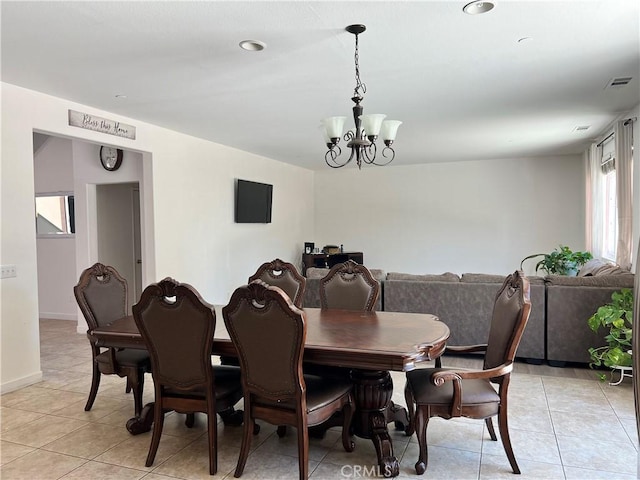 53209 Trailing Rose Dr, Lake Elsinore, CA 92532 - dining space with a chandelier, light tile patterned floors, and baseboards