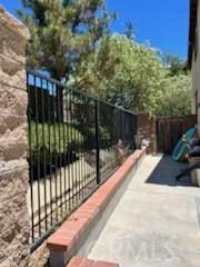 53209 Trailing Rose Dr, Lake Elsinore, CA 92532 - view of patio featuring fence