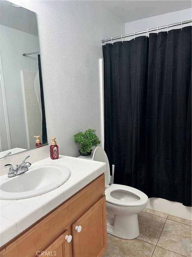 53209 Trailing Rose Dr, Lake Elsinore, CA 92532 - bathroom with vanity, toilet, tile patterned flooring, and a shower with shower curtain