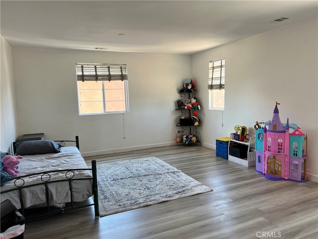 bedroom featuring hardwood / wood-style floors