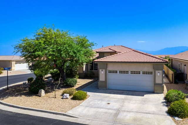 view of front of house featuring a mountain view and a garage