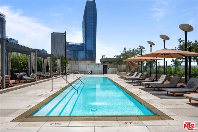 view of pool featuring a pergola and a patio area